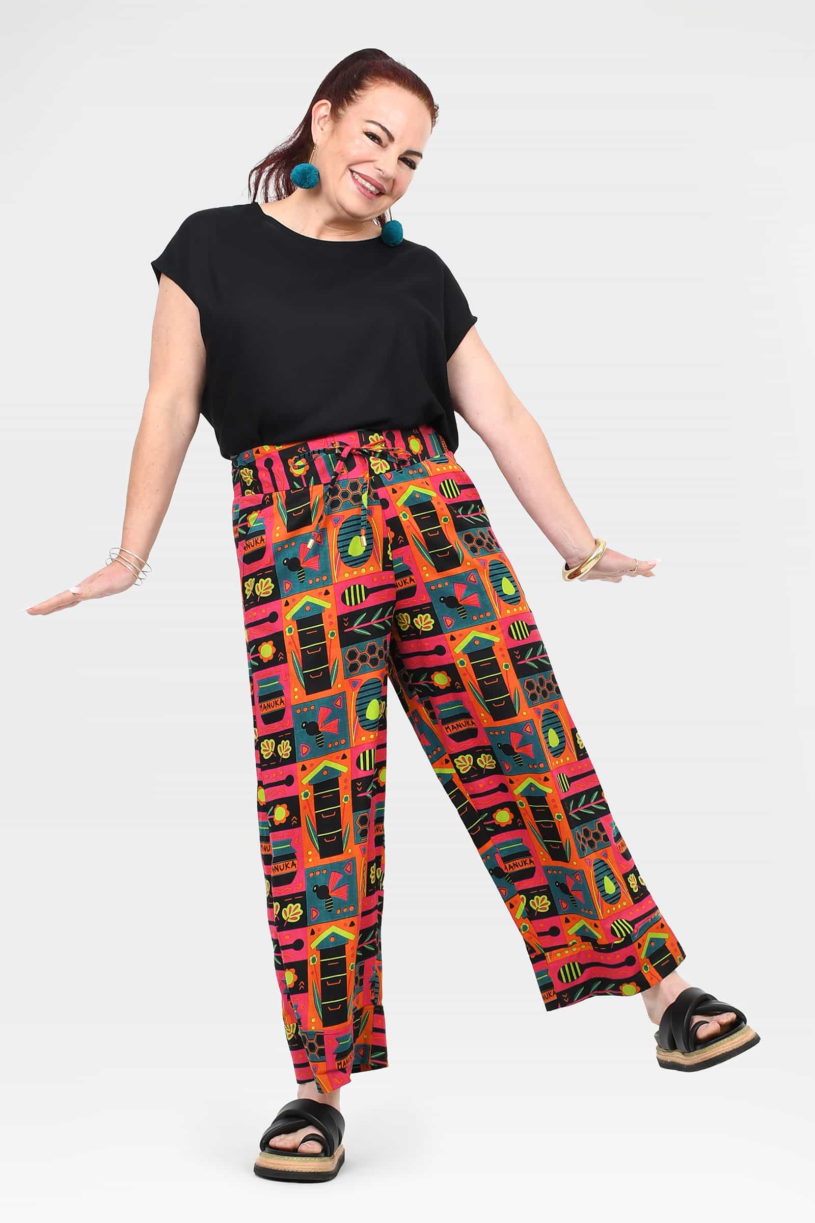 Wide-leg pants with colorful geometric and animal-like graphic print