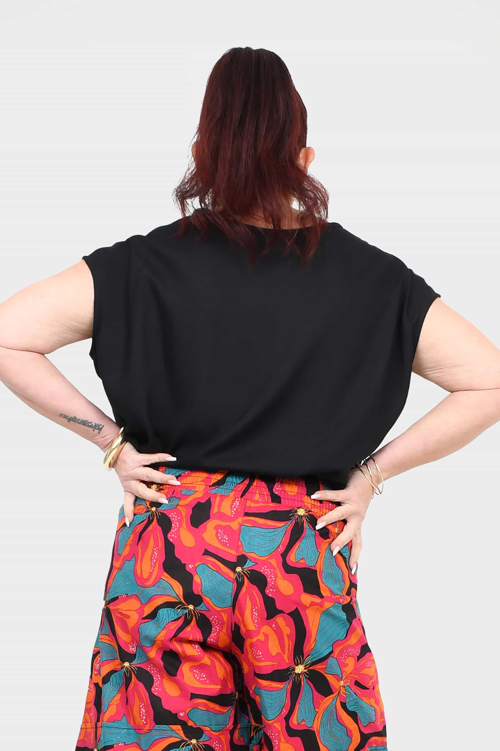 Black short-sleeve top back view with draped fabric
