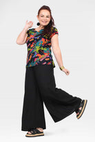 Black wide-leg pants with side step view; loose fit and elastic waist