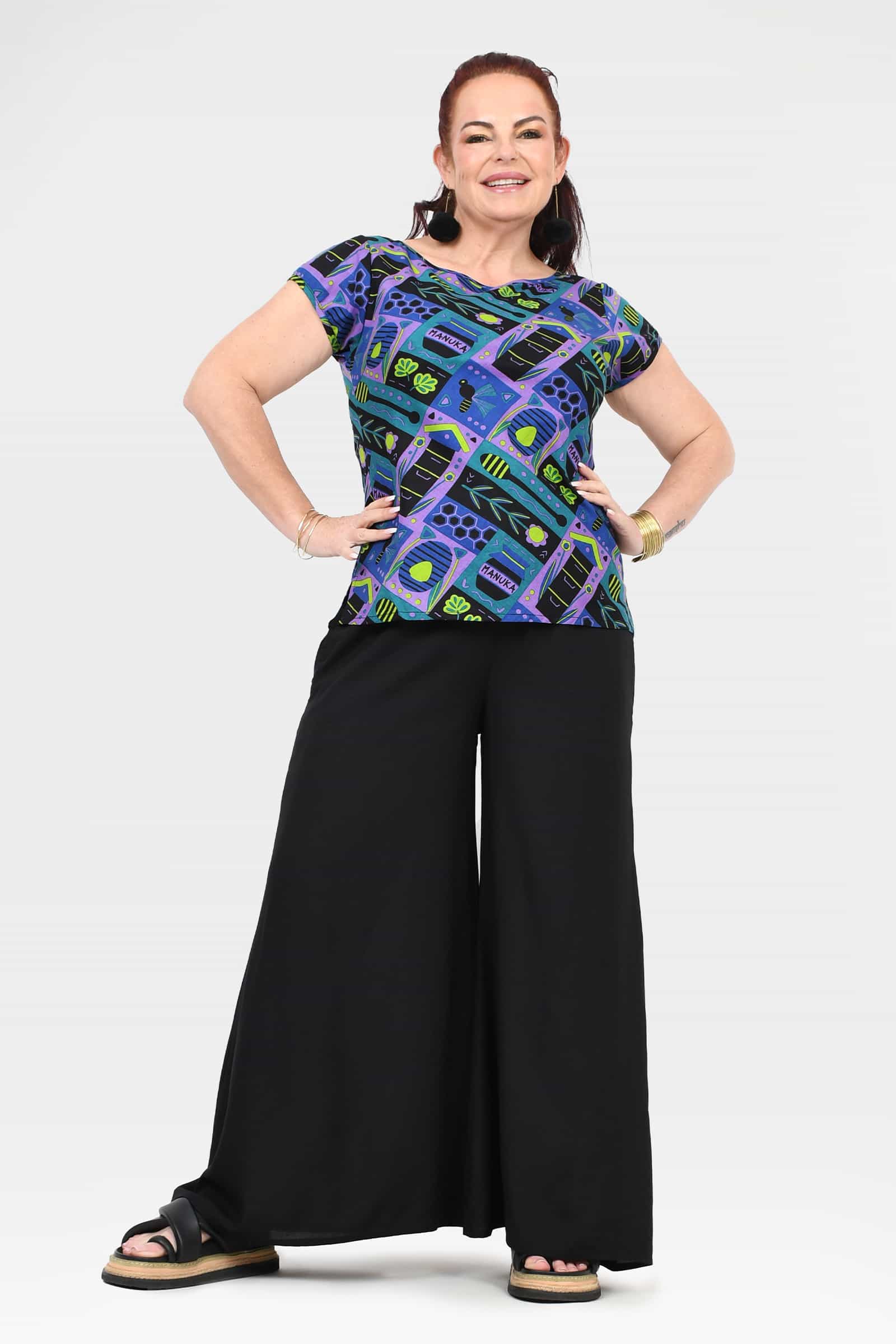 Black wide-leg pants with full front view; elastic waist and wide-leg hem