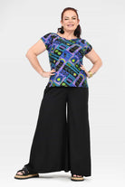 Black wide-leg pants with full front view; elastic waist and wide-leg hem