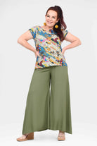Green wide-leg pants with flowing drape and long culotte length