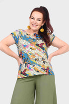 Women's front-view short-sleeve crewneck tee, white with bright abstract print