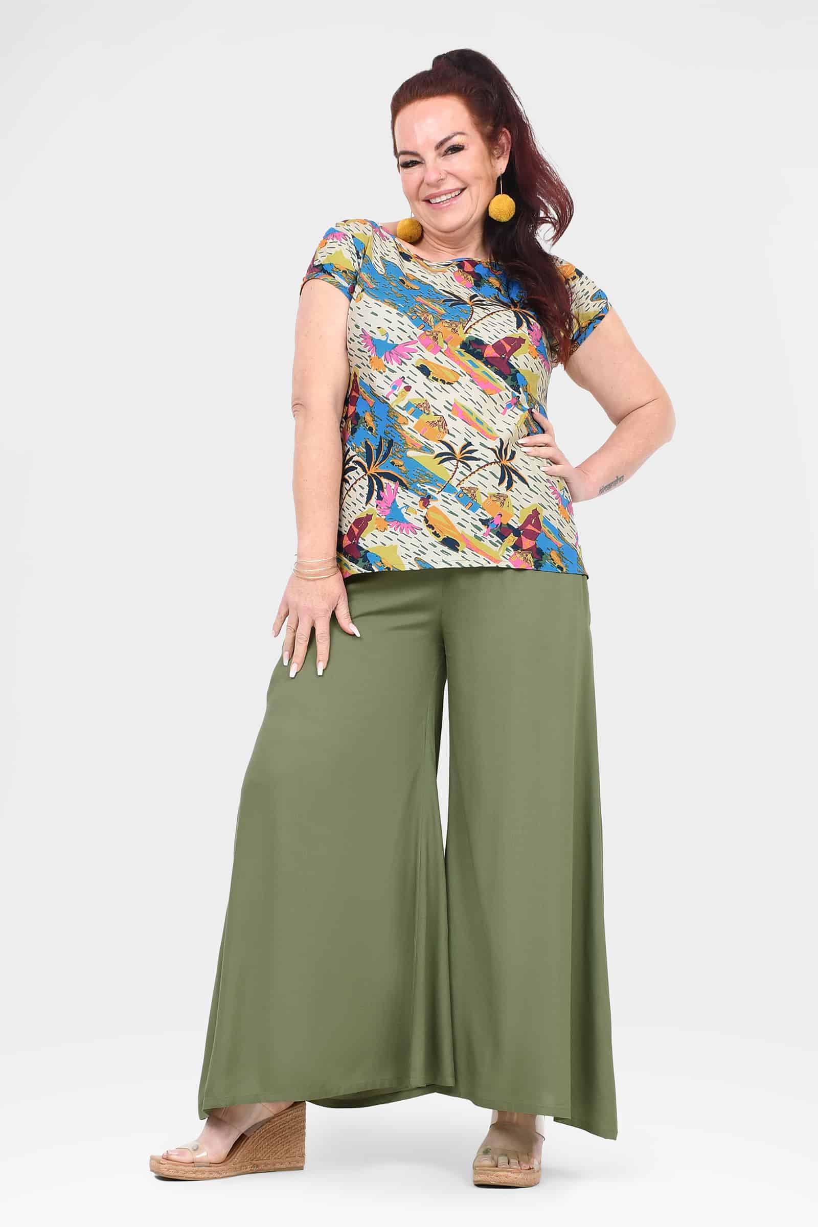 Green wide-leg pants with relaxed fit and wide, draped legs