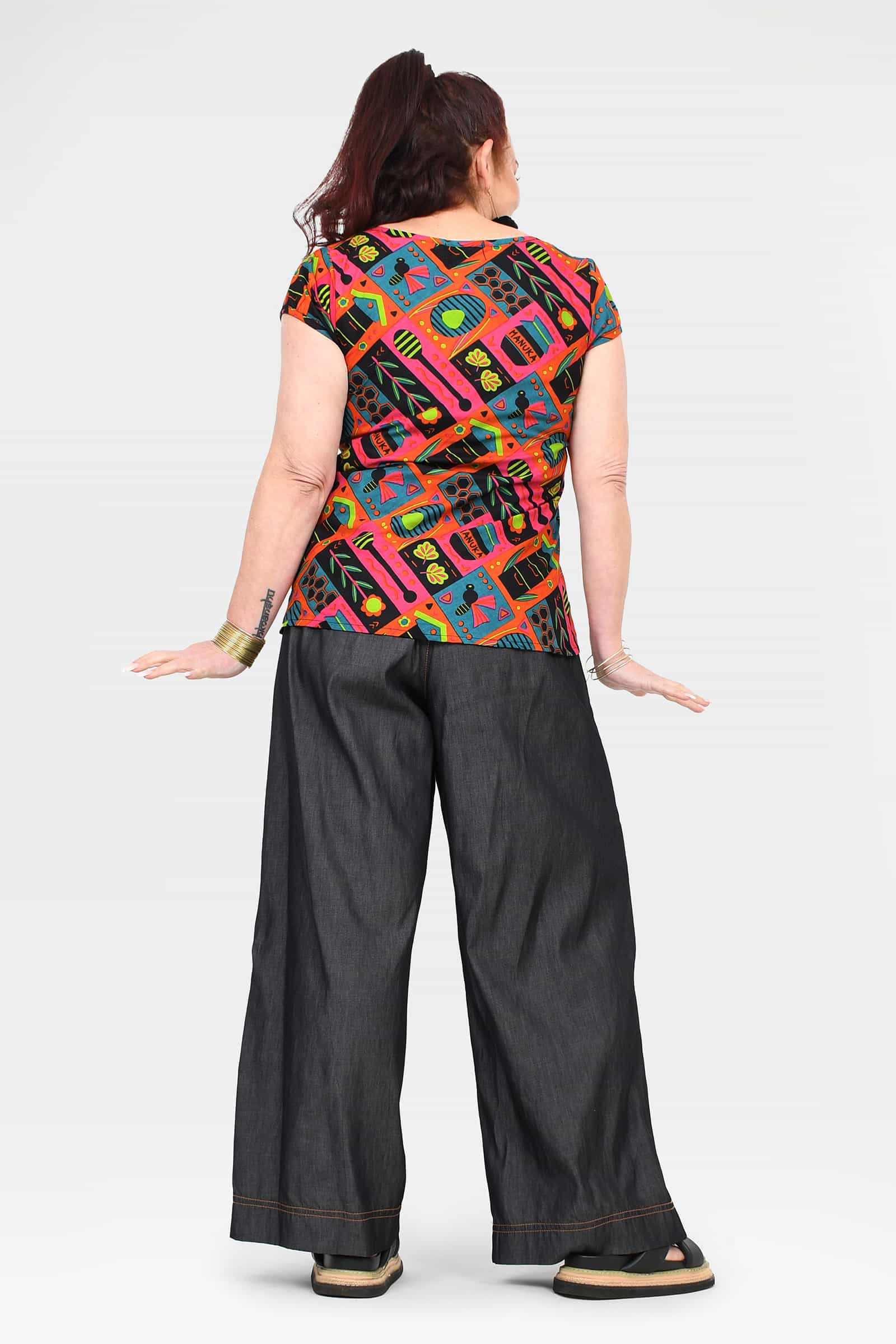Black denim wide-leg long pants, back view, contrast stitching and wide cuffs