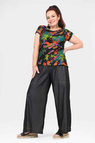 Black denim long pants with wide legs and contrast stitching at hems