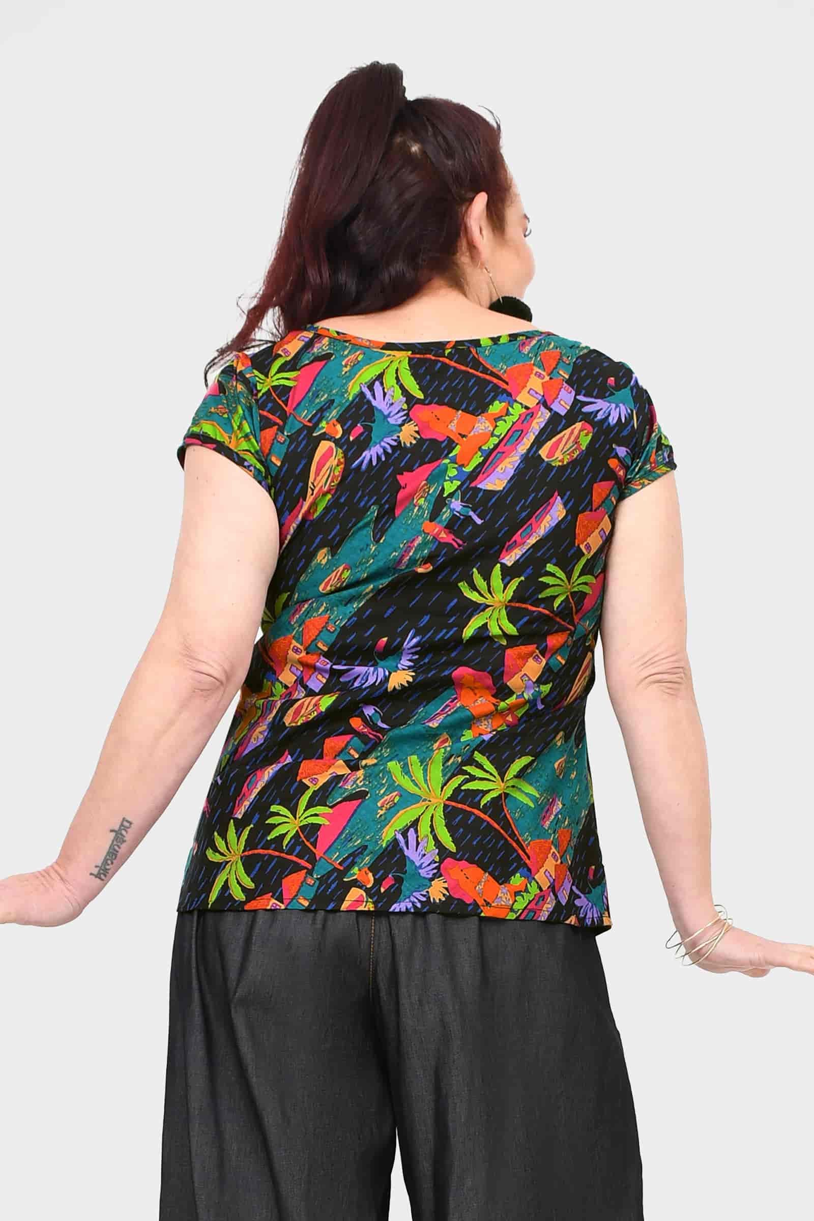 Levi tee, dark with tropical leaf and bird print, back view