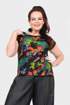 Levi tee, dark with tropical leaf and bird print, front view