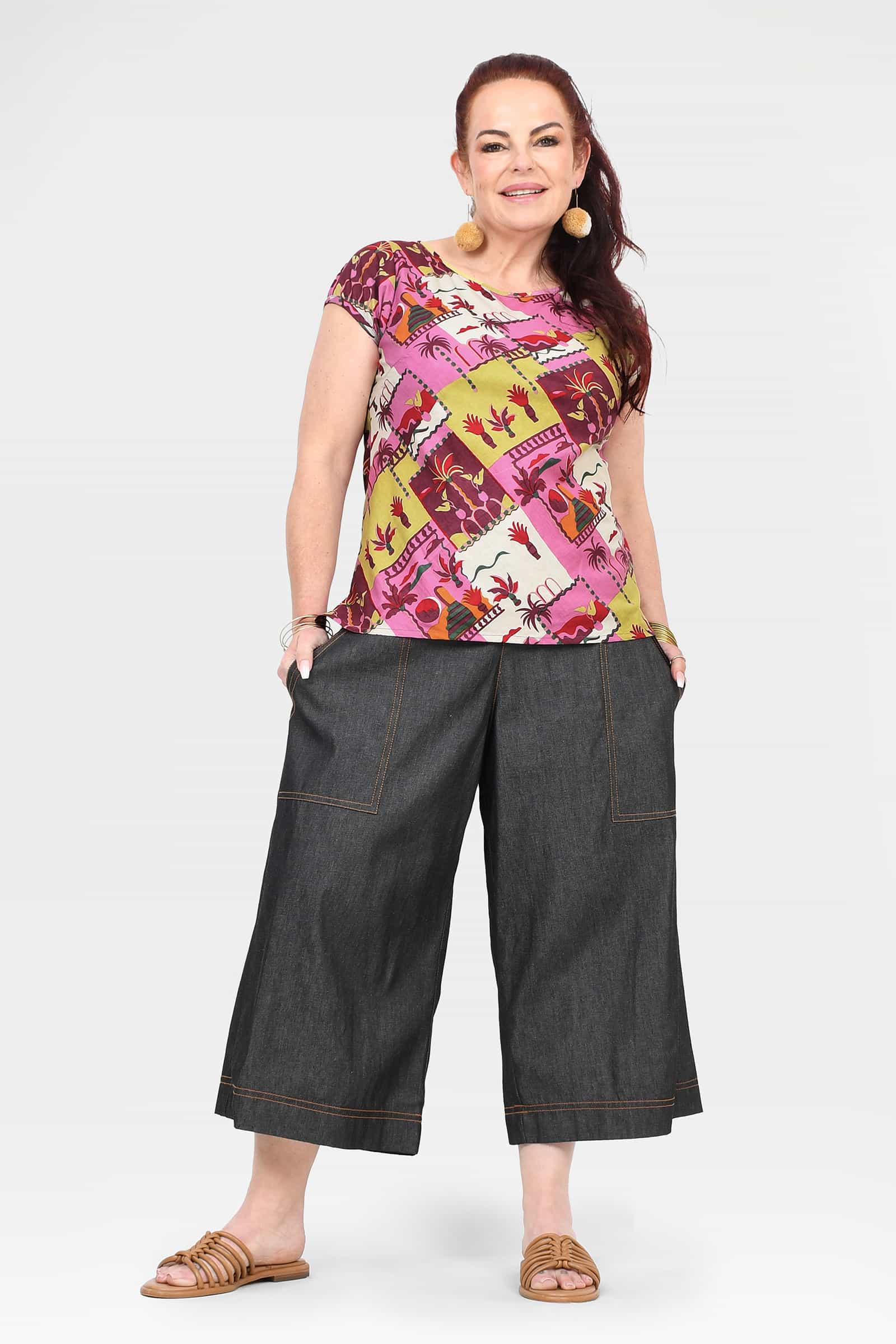 Black denim 3/4 pants with wide legs, patch pockets, and contrast-stitched seams