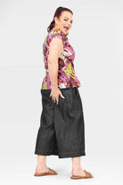 Black denim 3/4 pants, wide-leg cropped fit with side patch pockets and stitched hem