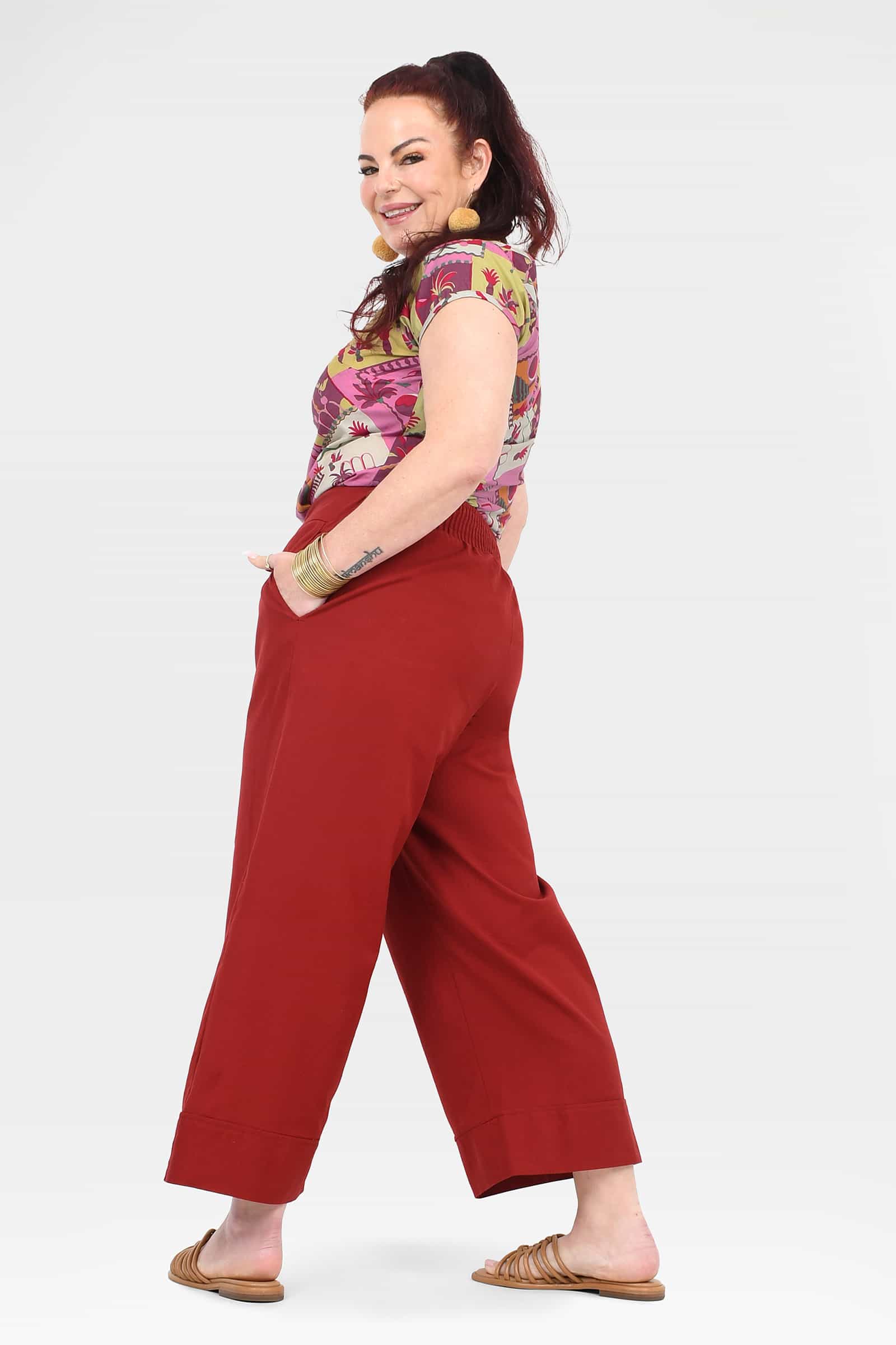 Dark red wide-leg ankle pants with drawstring waist and stitched hem