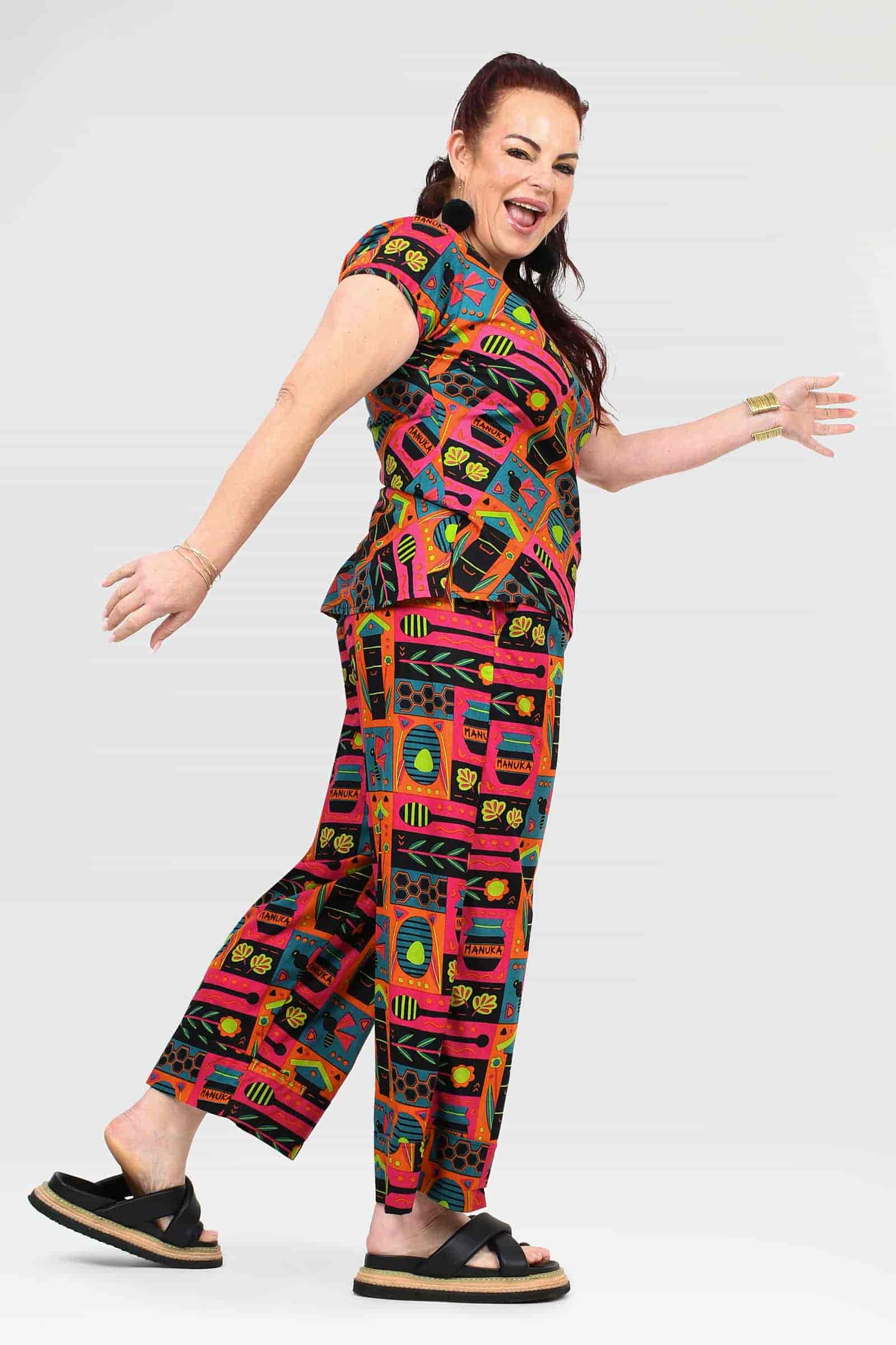 Wide-leg pants with colorful graphic print and elastic waistband, side view