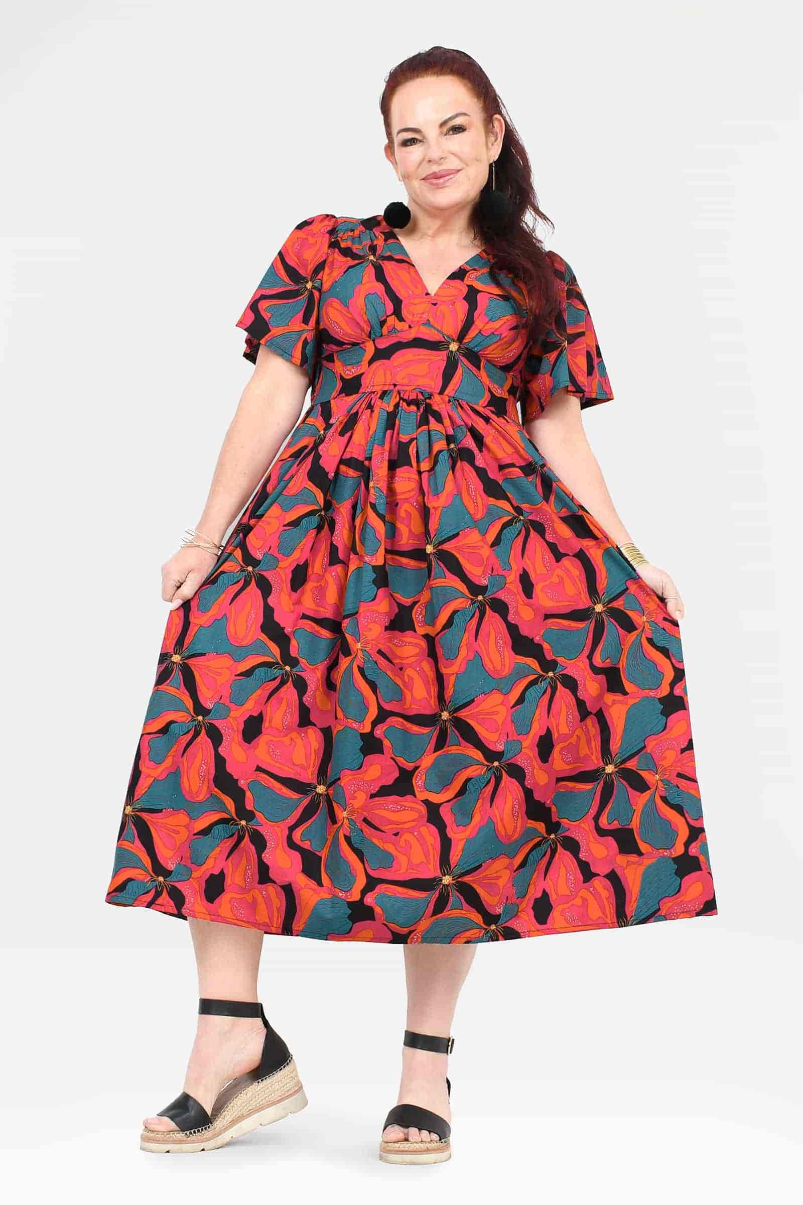 Midi dress with short sleeves, V-neck, gathered waist, and vivid floral abstract pattern