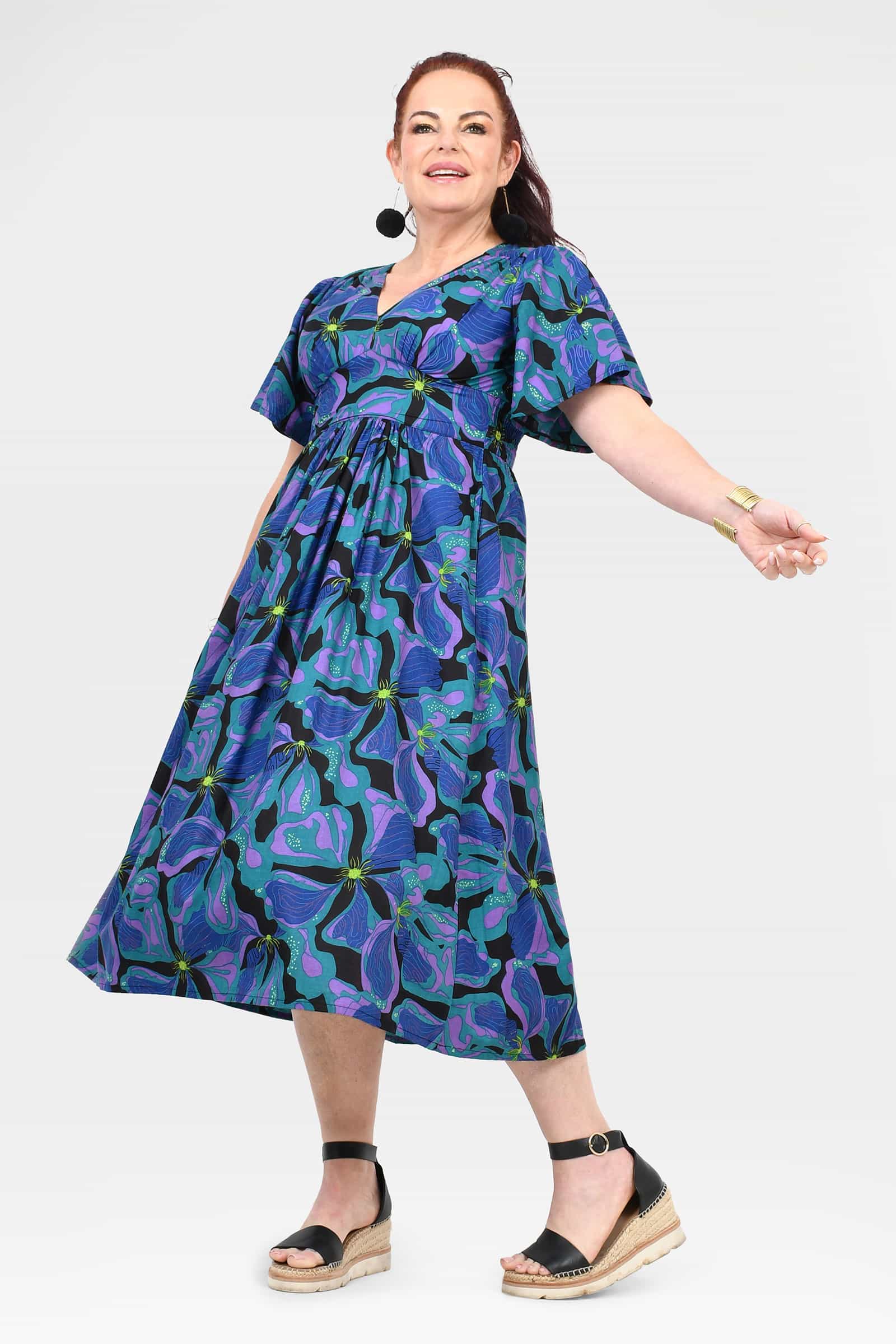 Teal and purple abstract-print midi dress with short sleeves and flowing skirt