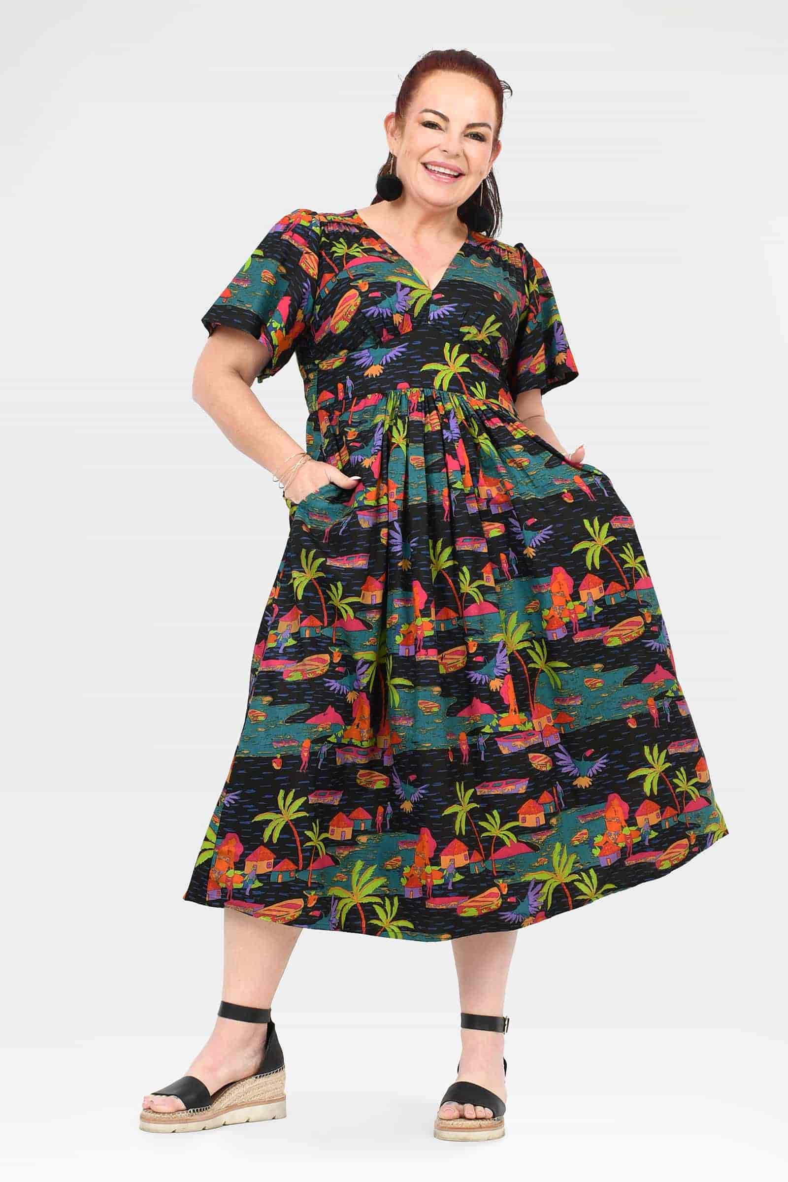 Printed midi dress with V-neck, short sleeves, gathered waist, tropical village scene