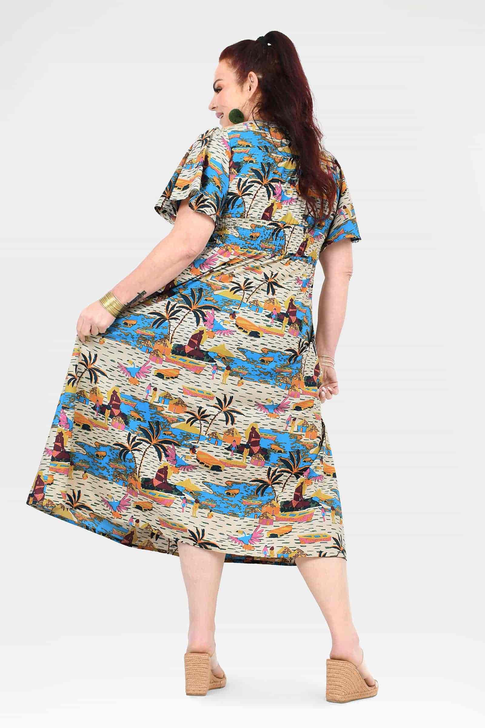 Back view of colorful printed midi dress with flutter sleeves and gathered waist