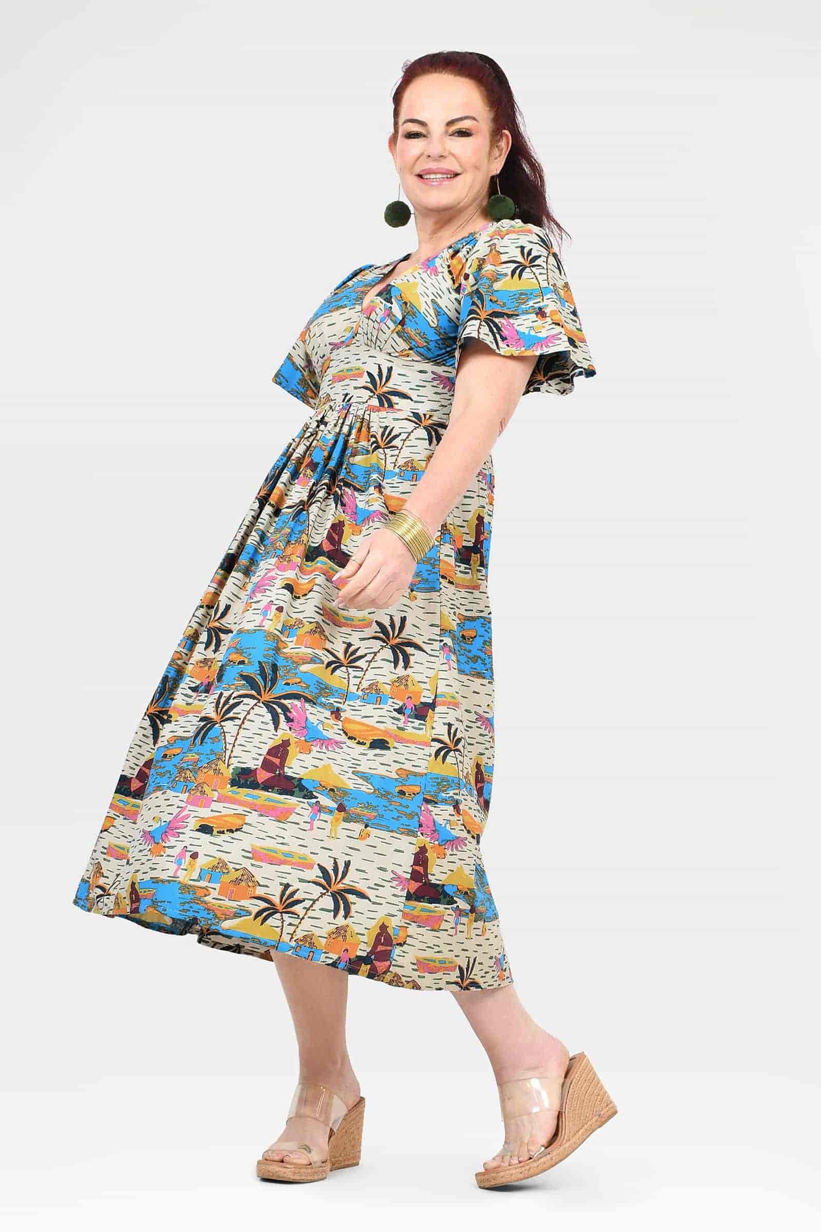 Side view of colorful printed midi dress with V-neck and short flutter sleeves
