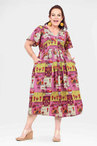 Pink midi dress with short sleeves and colorful animal-and-plant patch print