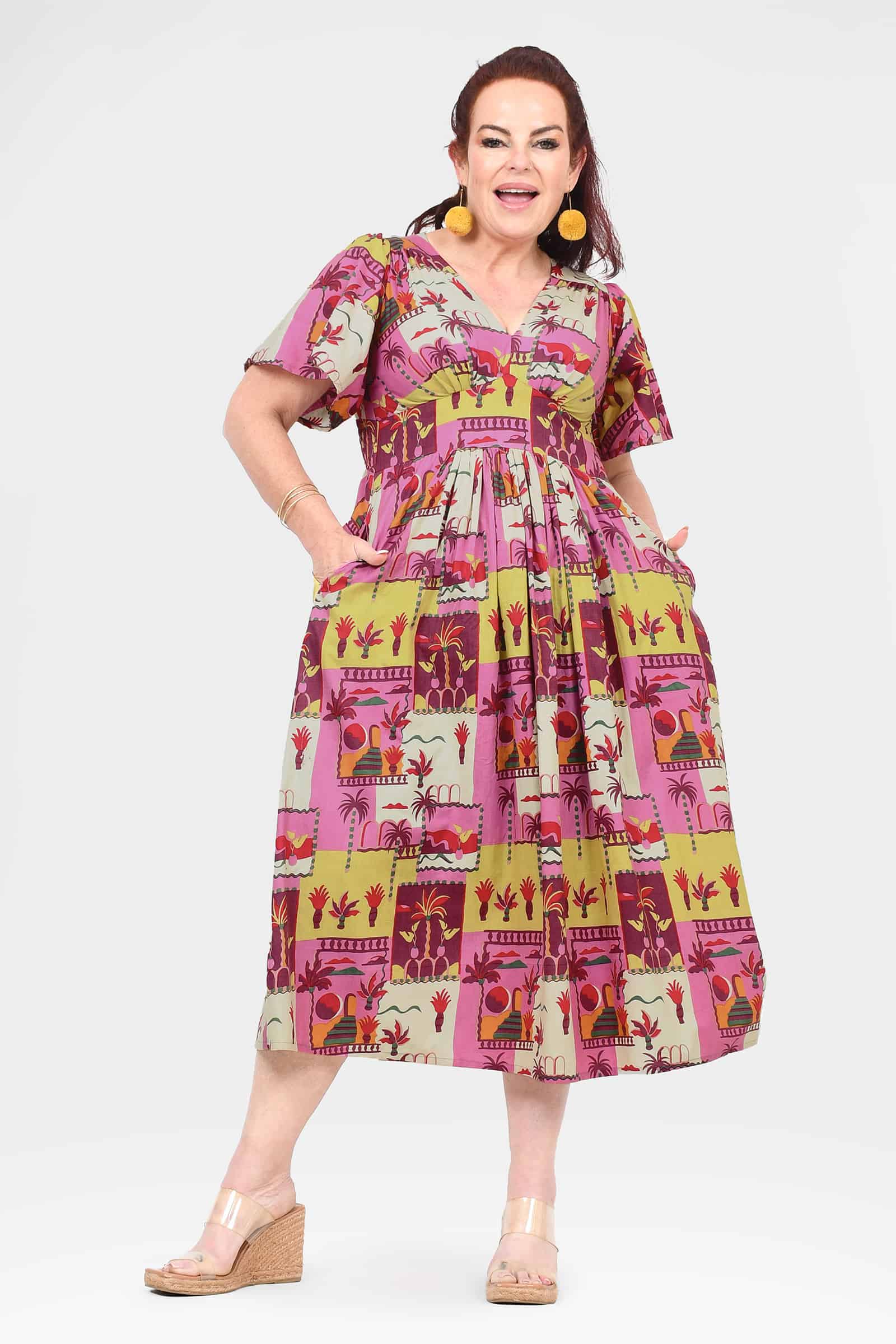 Pink midi dress with short sleeves and colorful animal-and-plant patch print