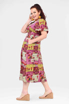 Pink midi dress with short sleeves, gathered waist, and animal patch print