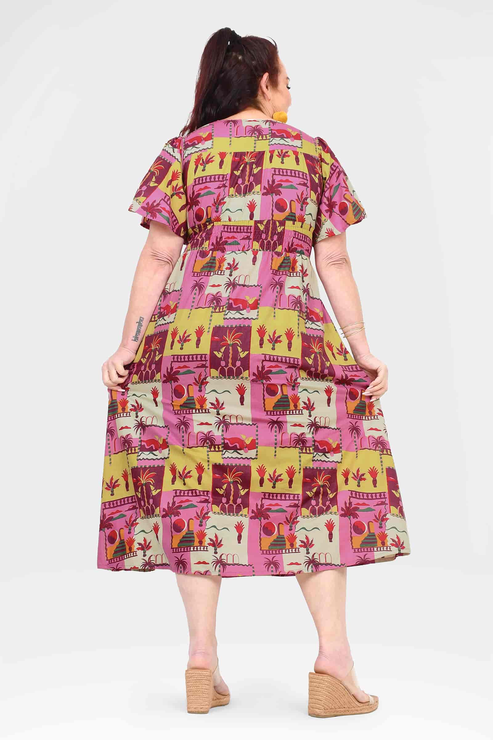 Pink midi dress back view with short sleeves and animal-and-plant patch print