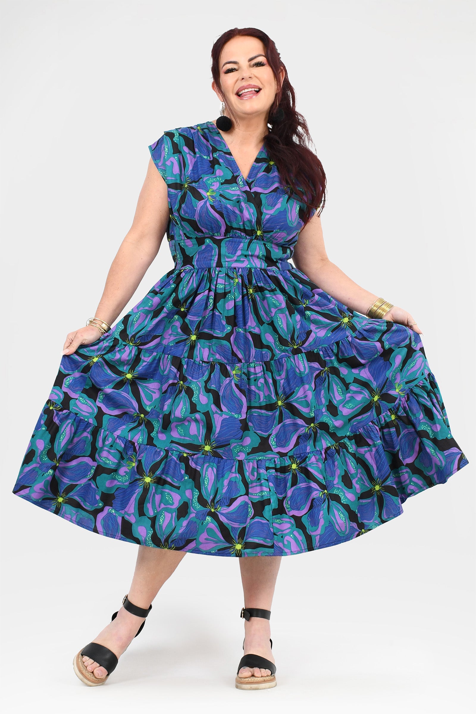 Printed teal and purple midi dress with cap sleeves and tiered ruffle skirt