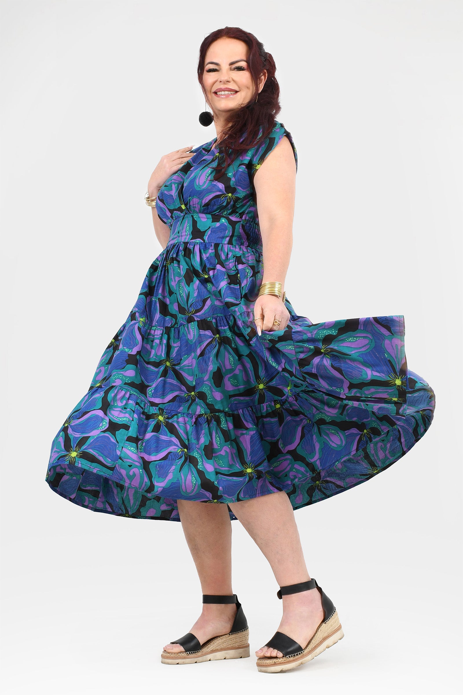 Printed teal and purple midi dress with gathered waist and flared tiered skirt