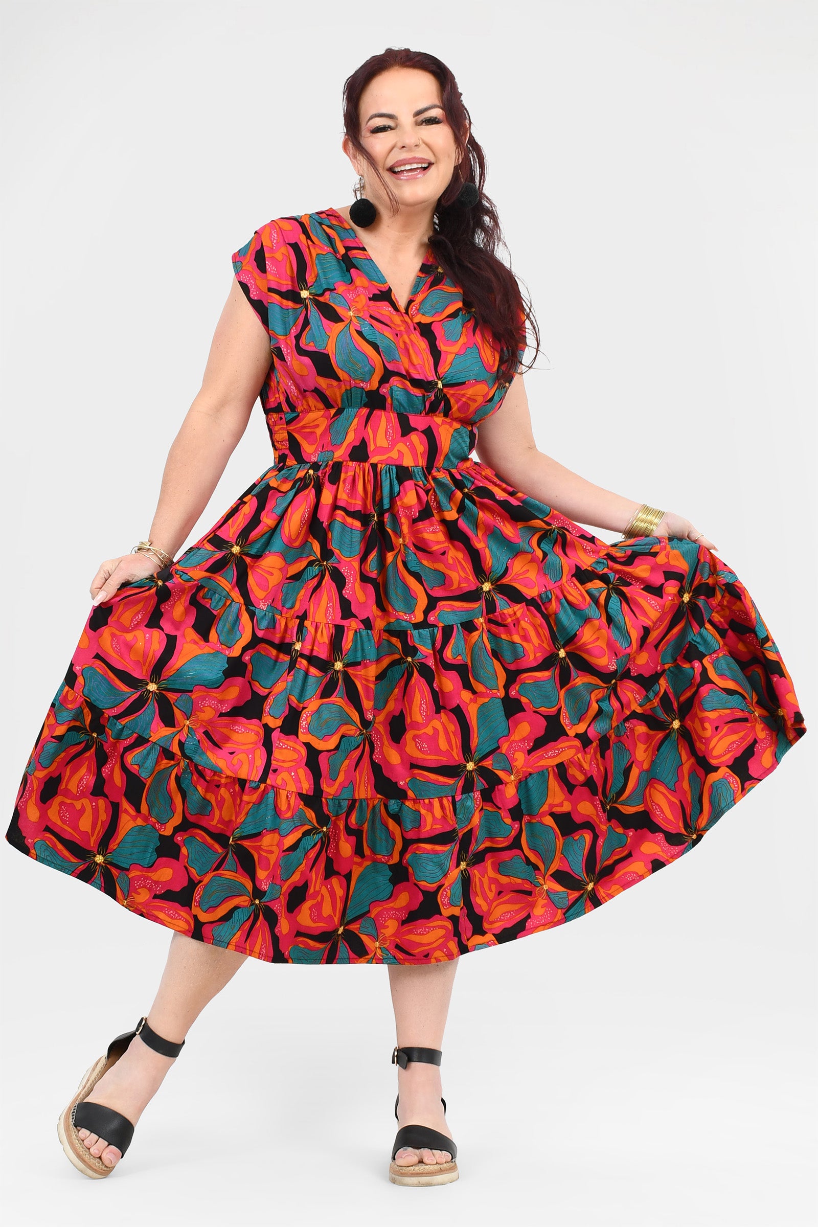 Red and teal floral tiered midi dress with short sleeves and gathered waist