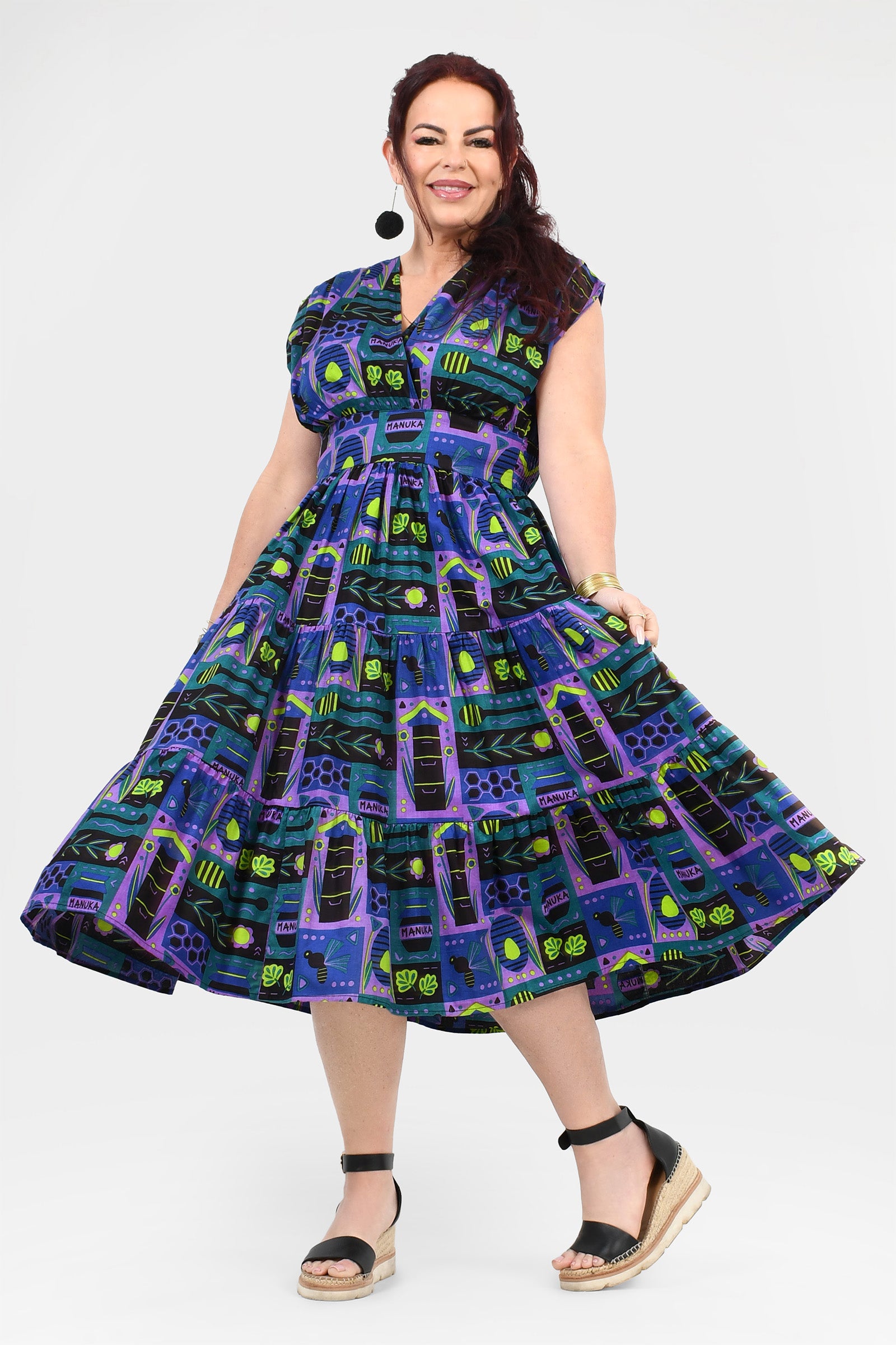 Multicolor printed midi dress, sleeveless with full pleated skirt, side view