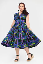 Multicolor printed midi dress, sleeveless with full pleated skirt, side view