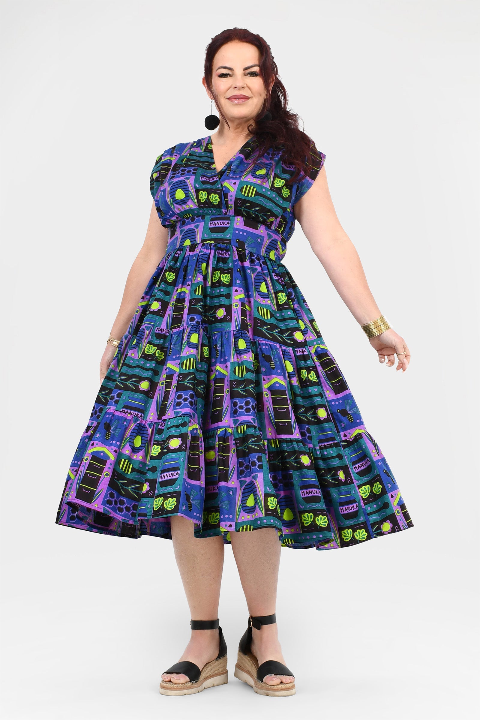 Multicolor printed midi dress, sleeveless with full pleated skirt, front view