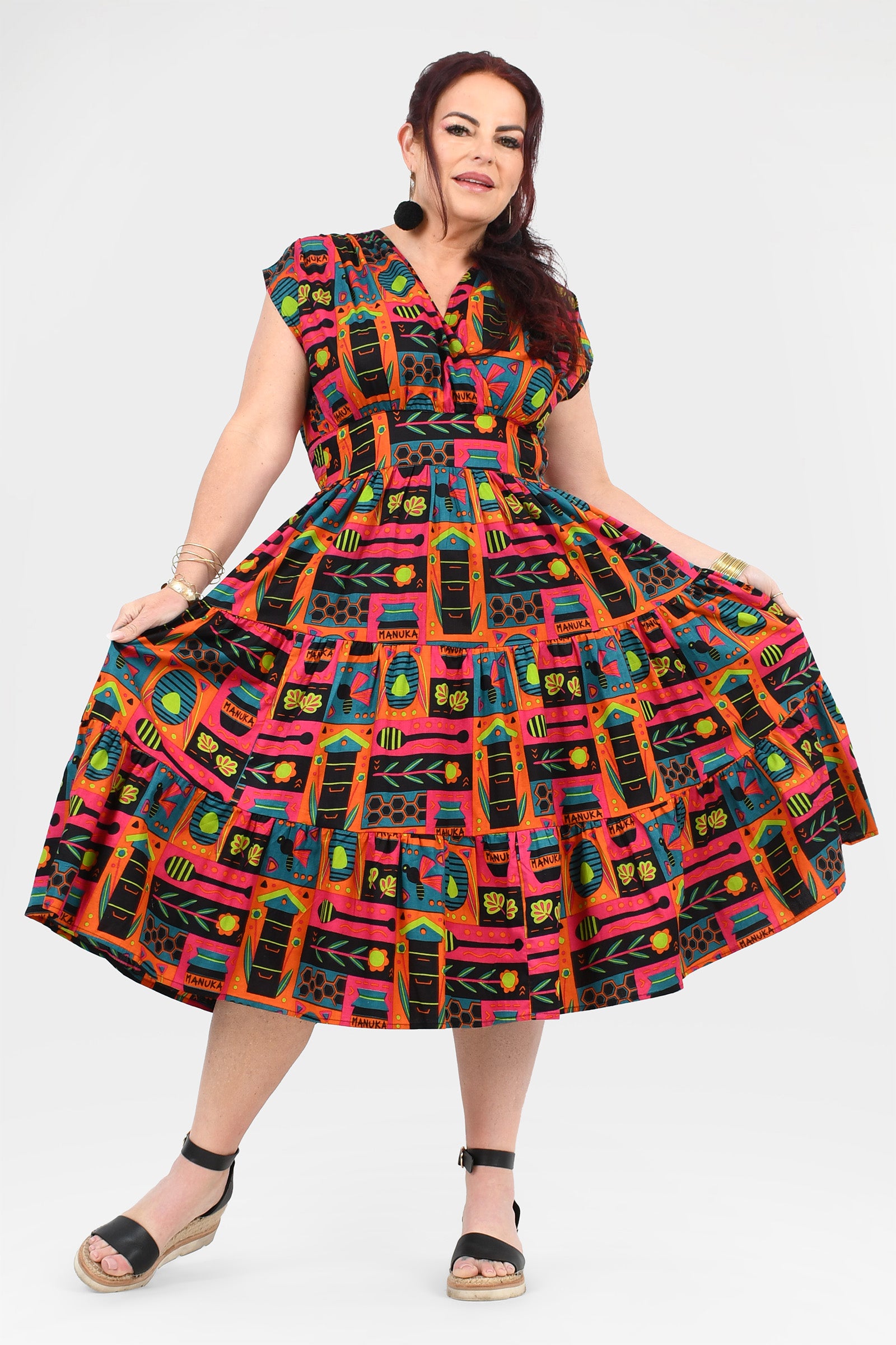Pink multicolor printed midi dress with short sleeves, gathered skirt, belted waist