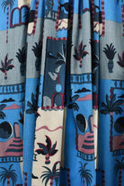 Tropical print pants in blue with beige, red and black motifs
