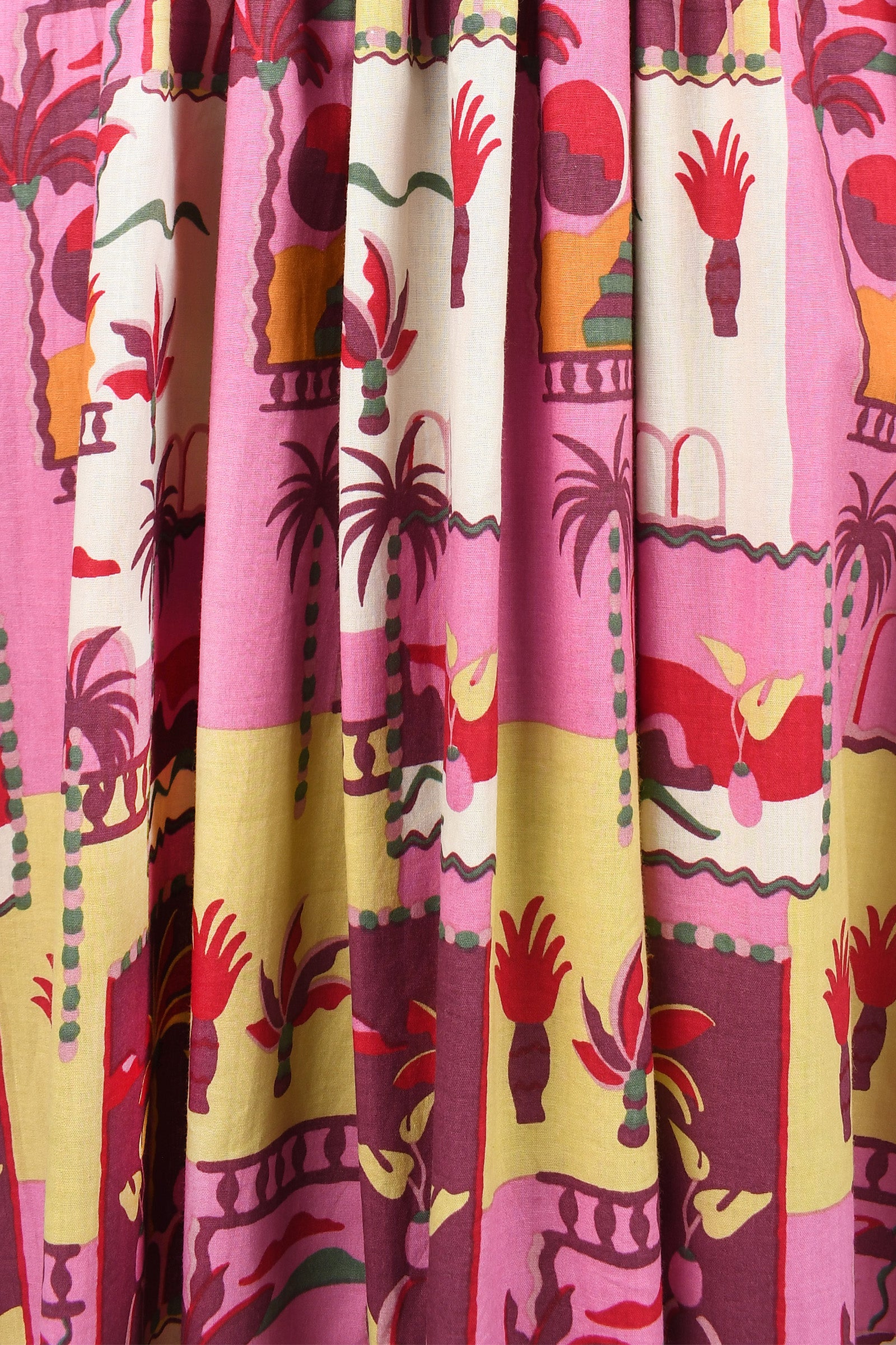 Havana pants fabric close-up: pink and cream base with multicolor animal silhouettes