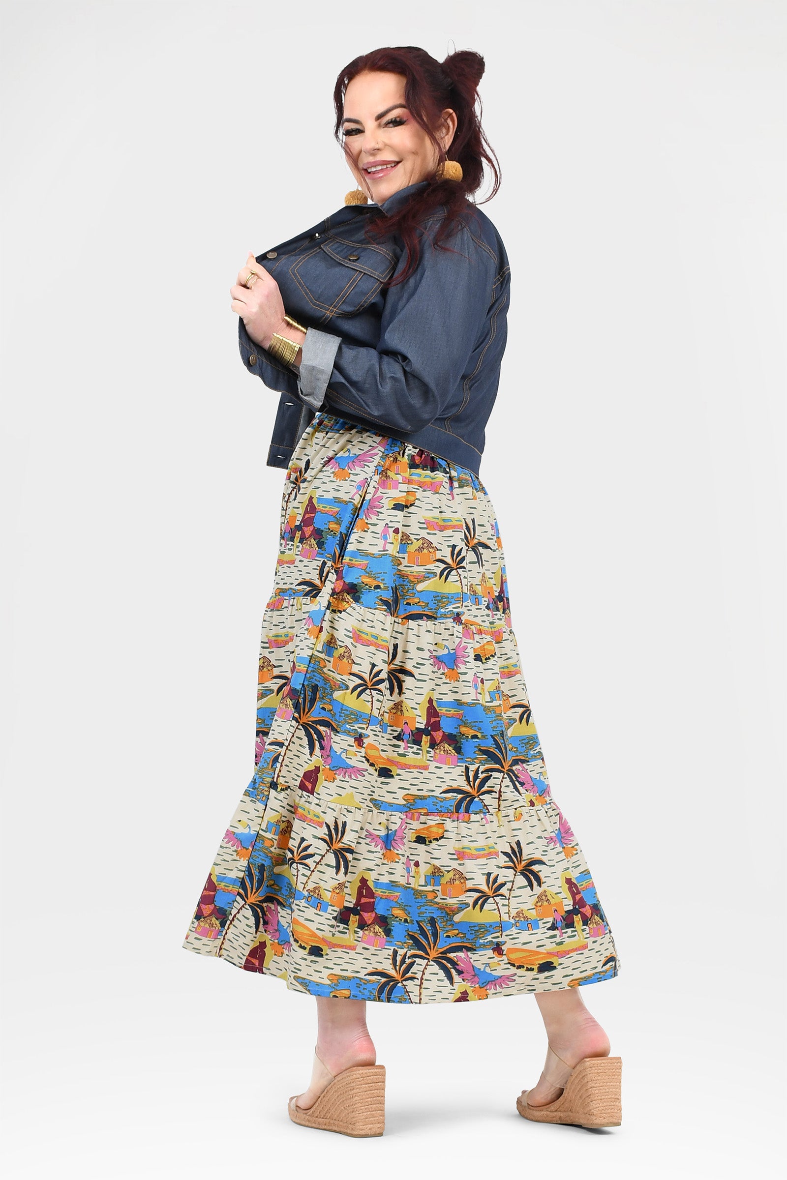 Multicolor tropical print maxi dress with sleeveless scoop neckline and flared skirt