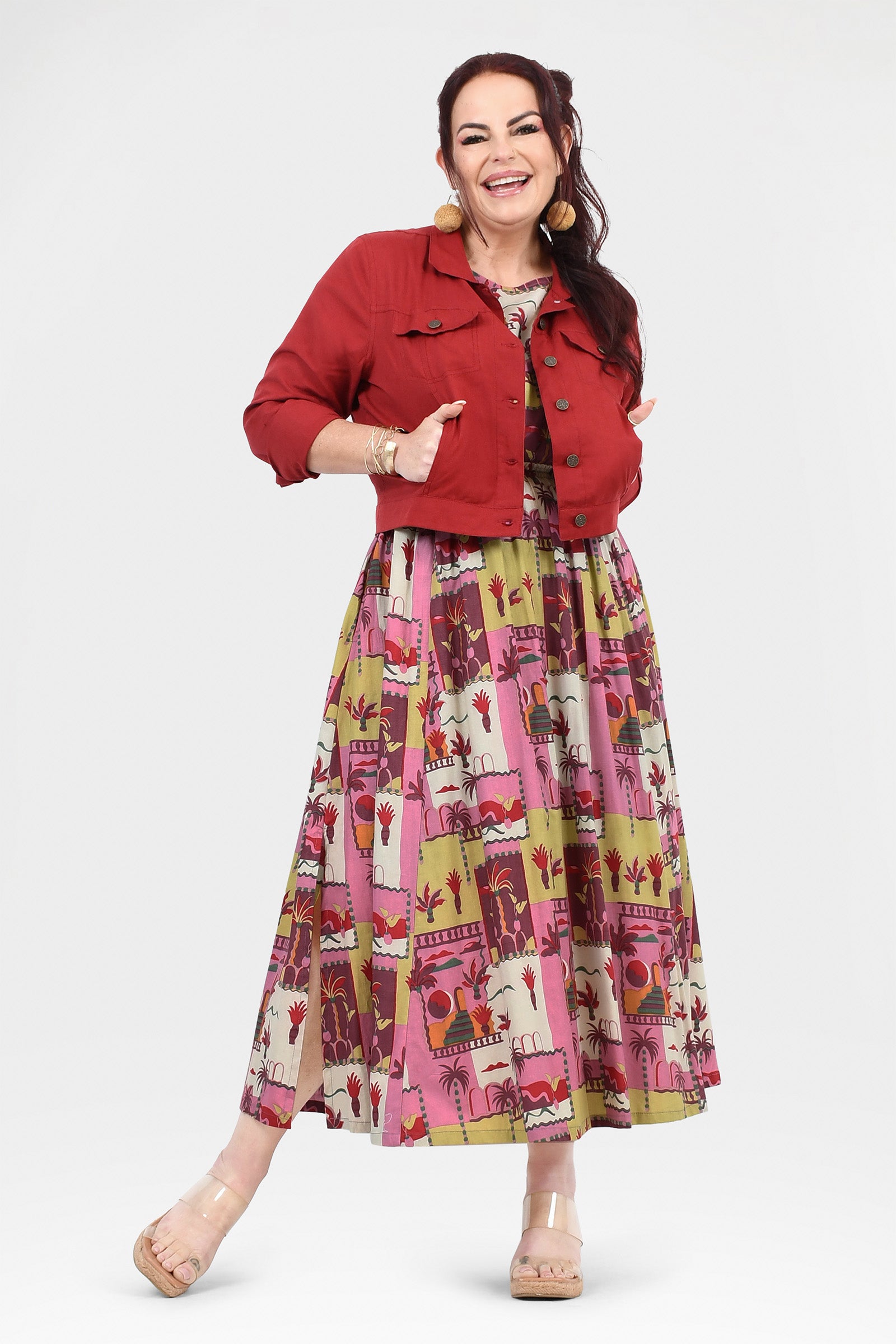 Pink long dress with colorful animal and cactus print, gathered waist and flared skirt