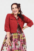Dark red utility jacket with button closure, epaulets, and flap chest pockets