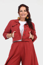 Dark red jacket with button-up front, stand collar, and flap chest pockets