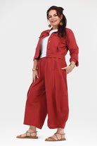 Dark red wide-leg pants with elastic waist and relaxed, full-length legs.