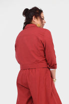Dark red back view jacket with fitted waist tie and buttoned yoke seams