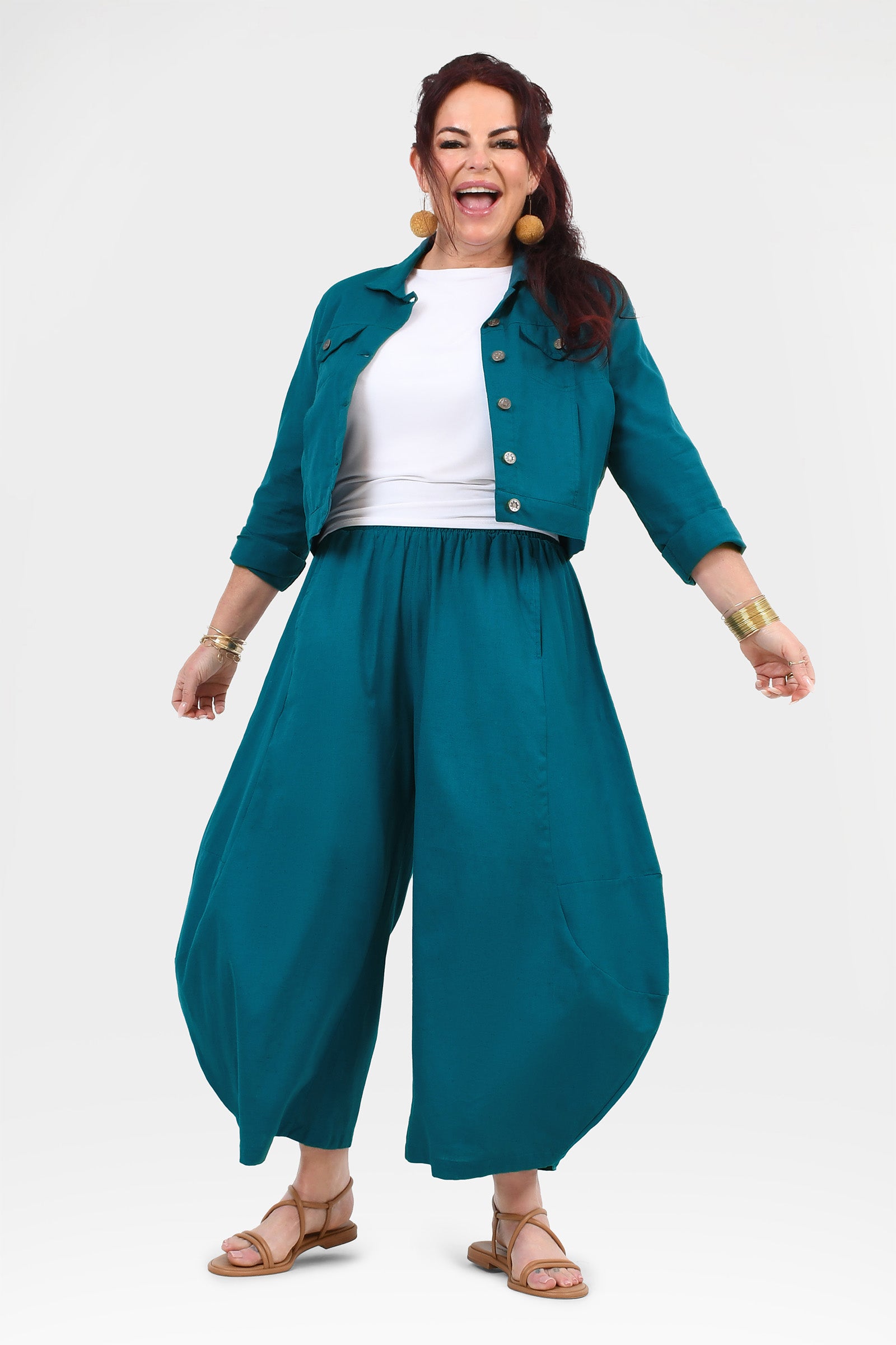 Dark teal wide-leg pants with roomy balloon-like silhouette