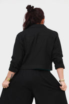 Black cropped jacket back view with stand collar and button details