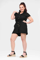Black button-front short-sleeve romper with tie waist and above-knee pockets