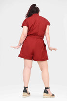 Dark red romper back view with short sleeves and tied waist