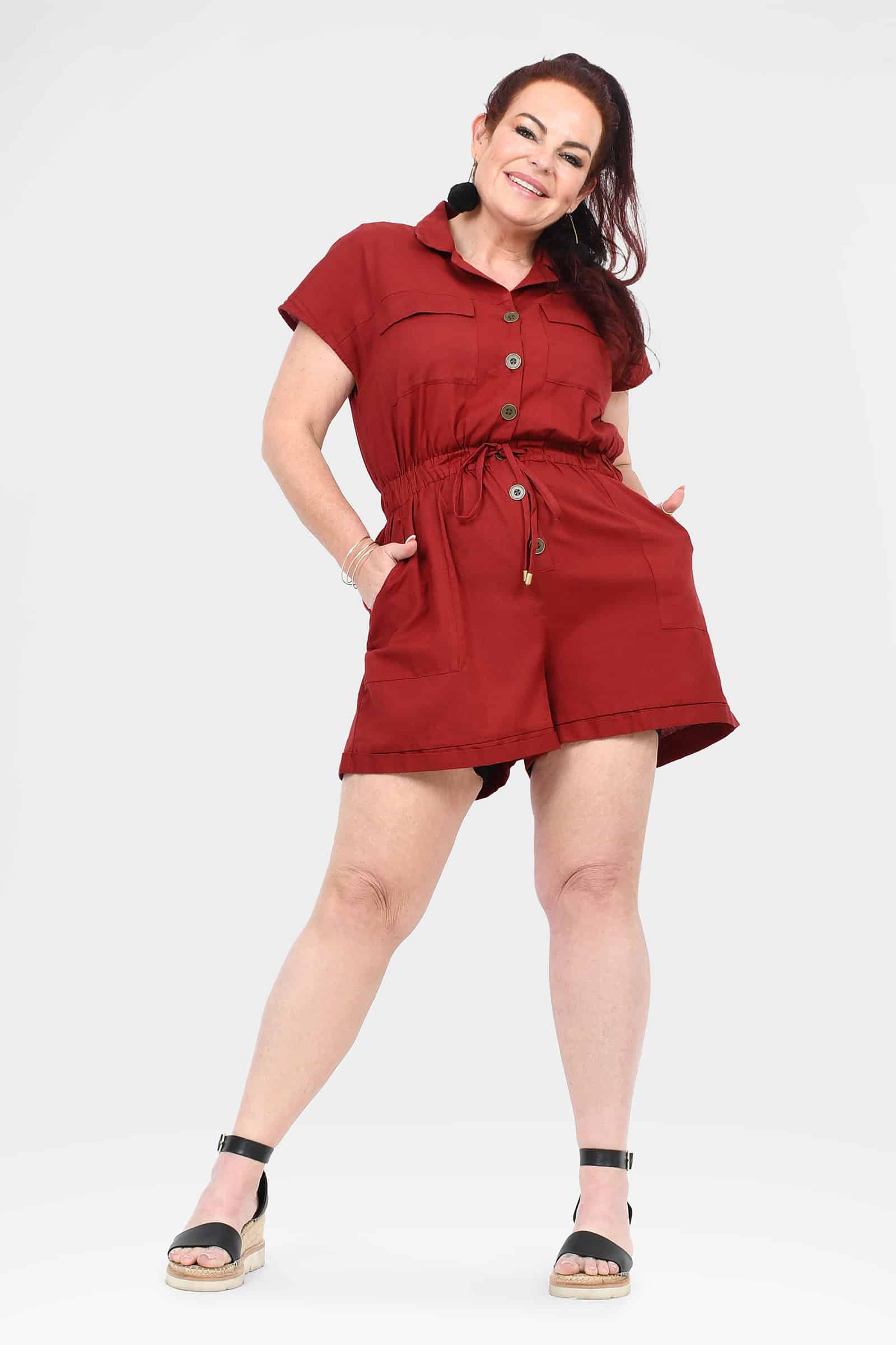 Dark red short romper with collar, front buttons, and adjustable tie waist