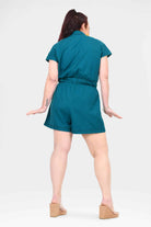 Dark teal belted romper with short sleeves, back view