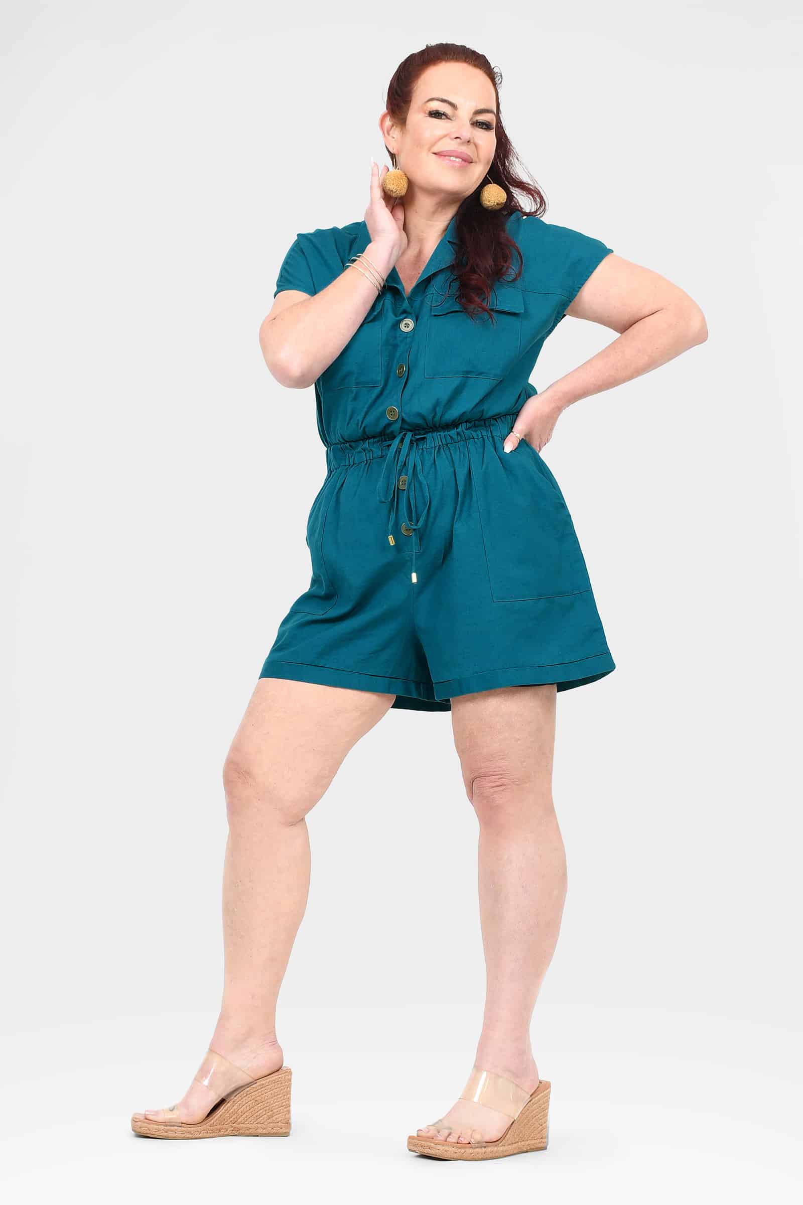 Dark teal button-front romper with drawstring waist and side pockets