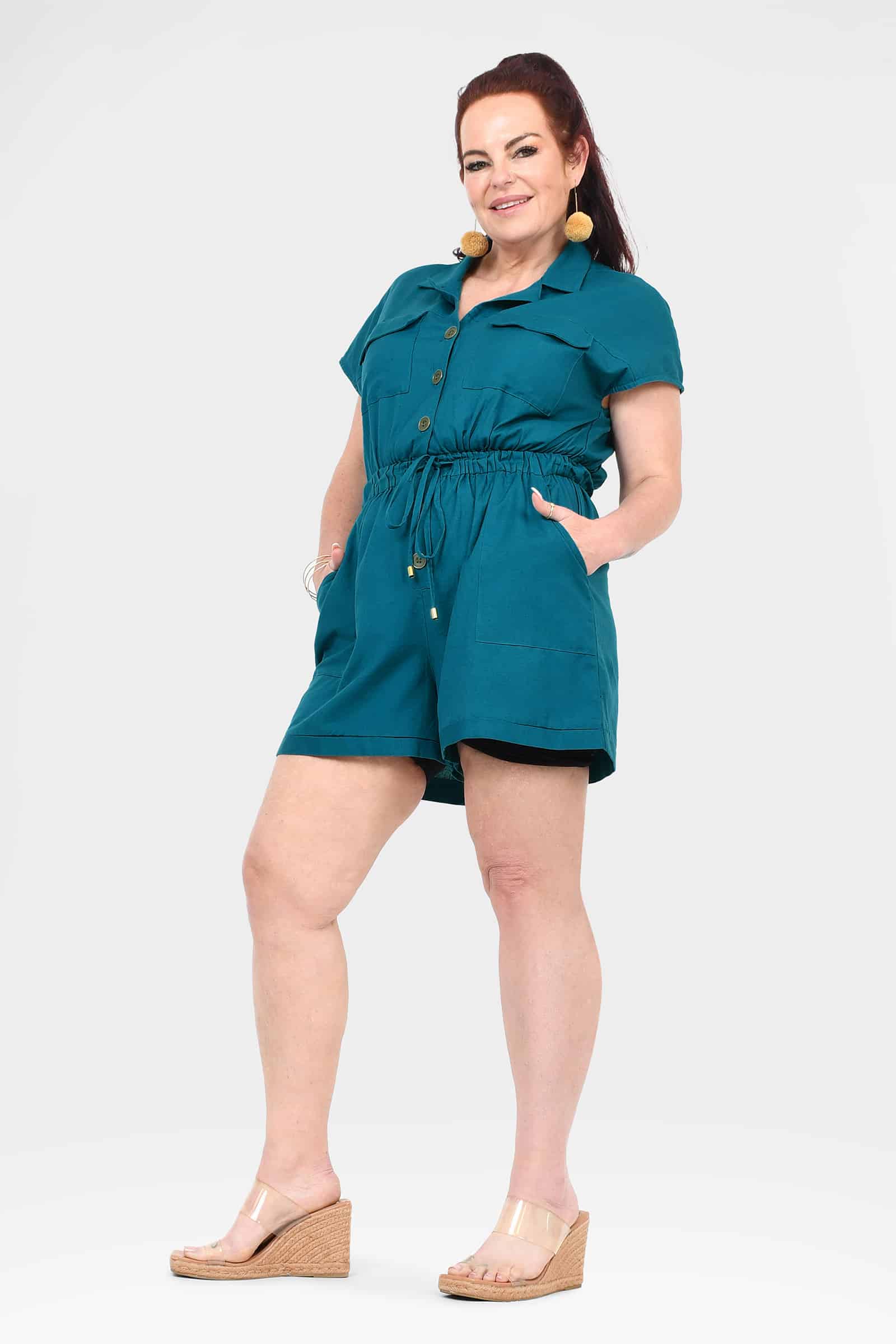 Dark teal short-sleeve romper with gathered waist and button placket