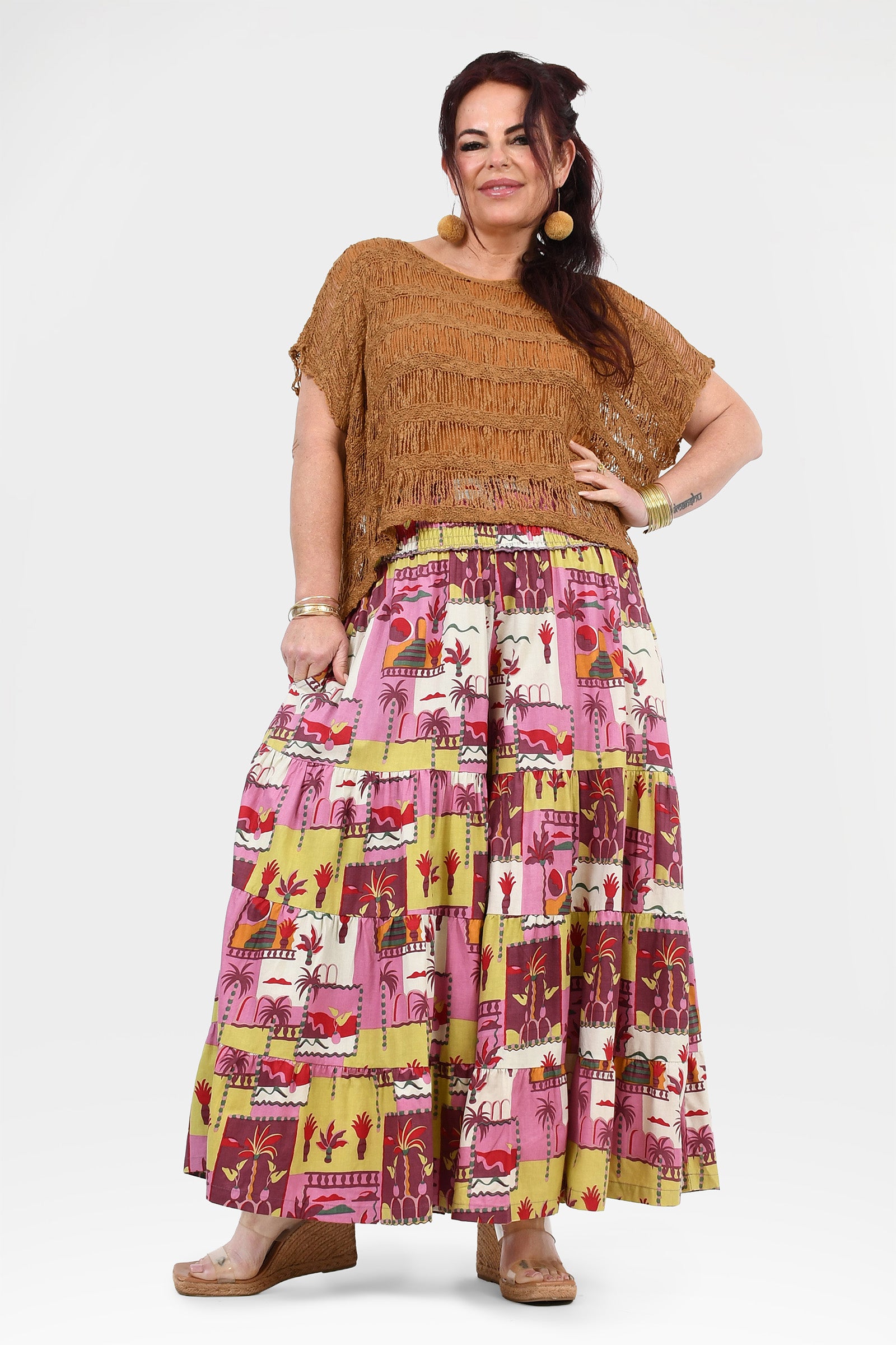 Printed wide-leg pants in pink with multicolor animal motifs and tiered look