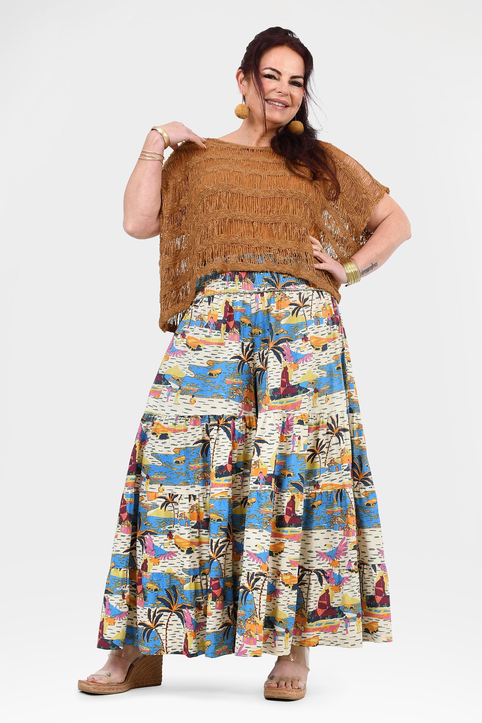Wide-leg printed pants with white base and blue-orange jungle pattern, elastic waist